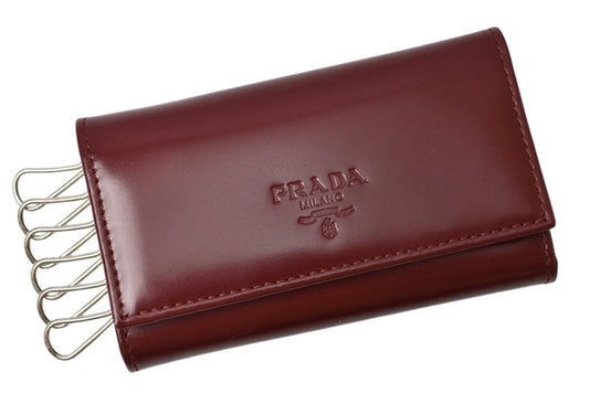 プラダ キーケース/キーホルダー PRADA 6連 レザー ボルドー ワインレッド ロゴ刻印 レディース メンズ 【中古】